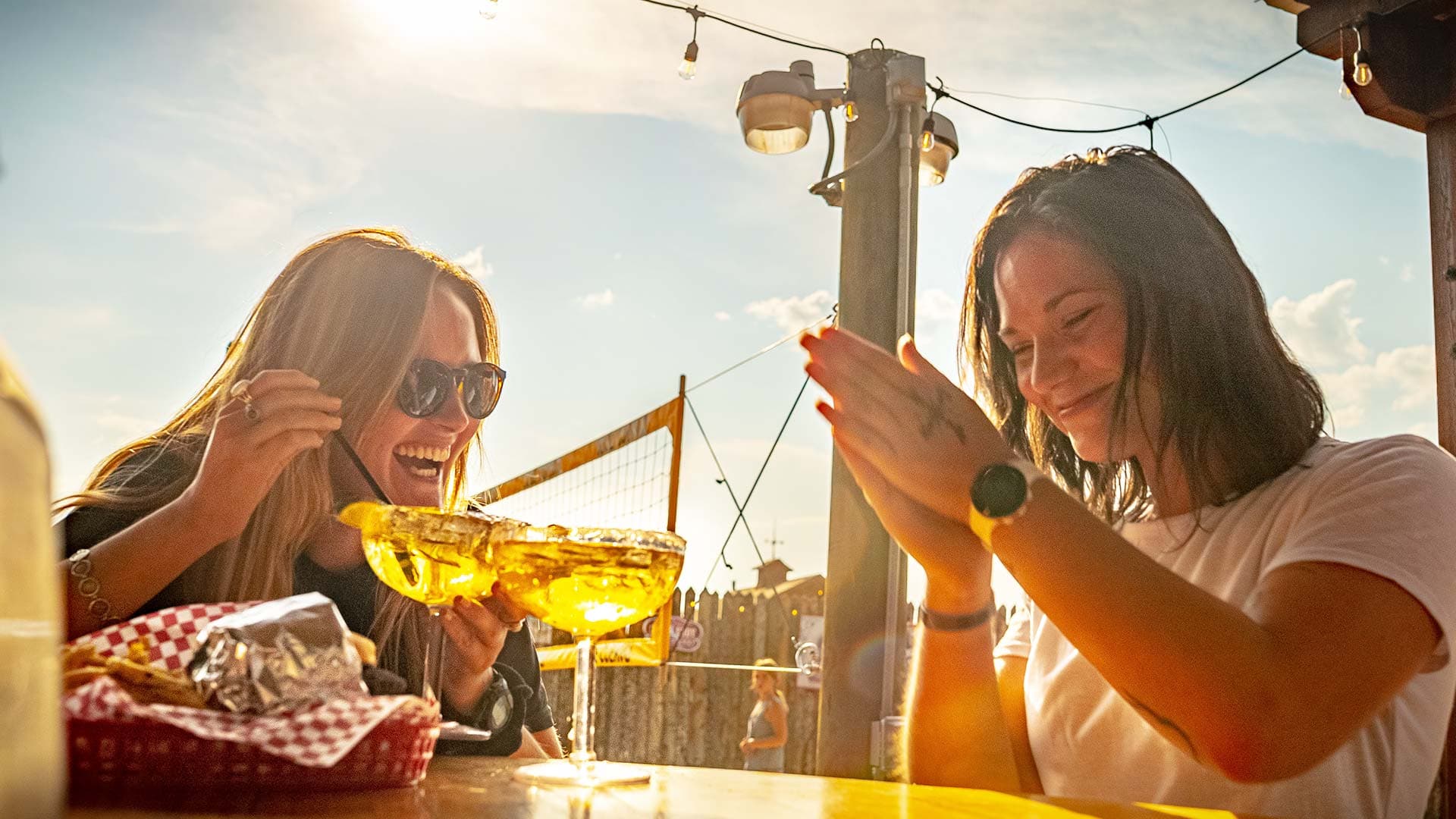 Friends enjoying margaritas at Whitewater Bar & Grill