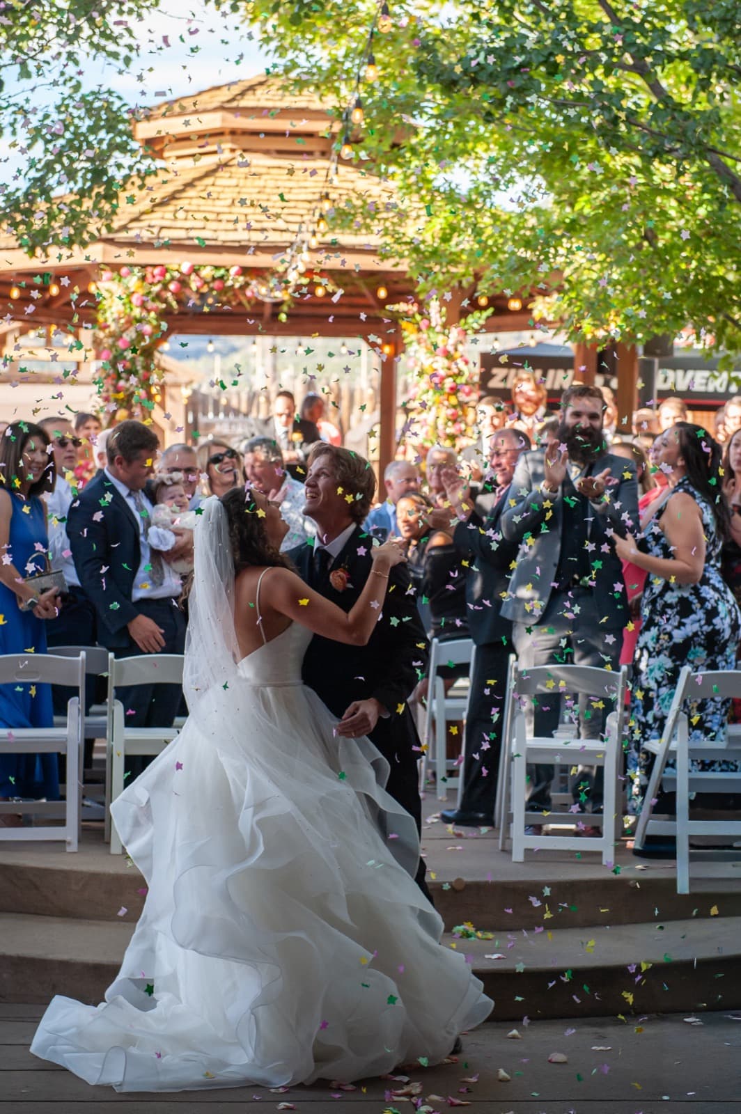 Confetti toss exit after ceremony with guests cheering